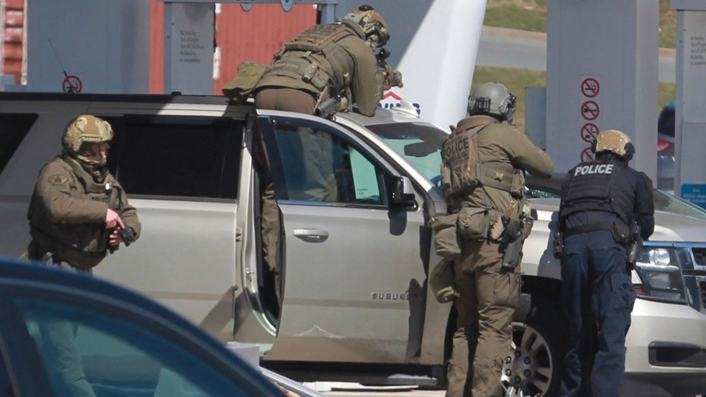 Royal Canadian Mounted Police officers during a manhunt for a gunman